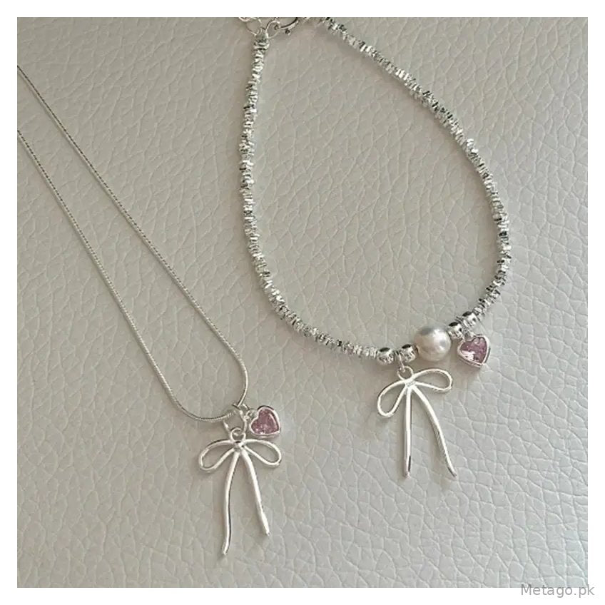 Broken Silver Bracelet with Love Bow & Pearl Accents