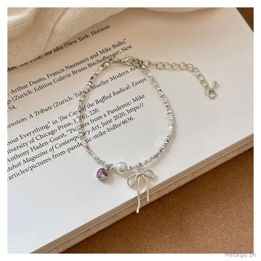 Broken Silver Bracelet with Love Bow & Pearl Accents