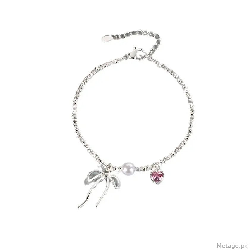 Broken Silver Bracelet with Love Bow & Pearl Accents